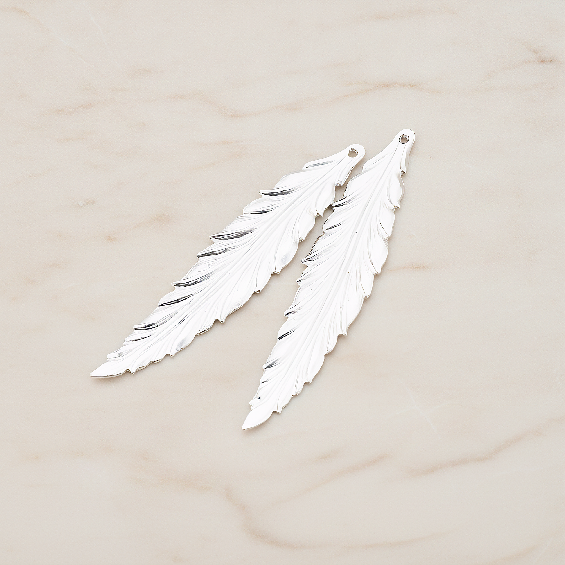 Thin Long Leaf Pendant, 2 Pc on warm marble background (PD.575-02)
