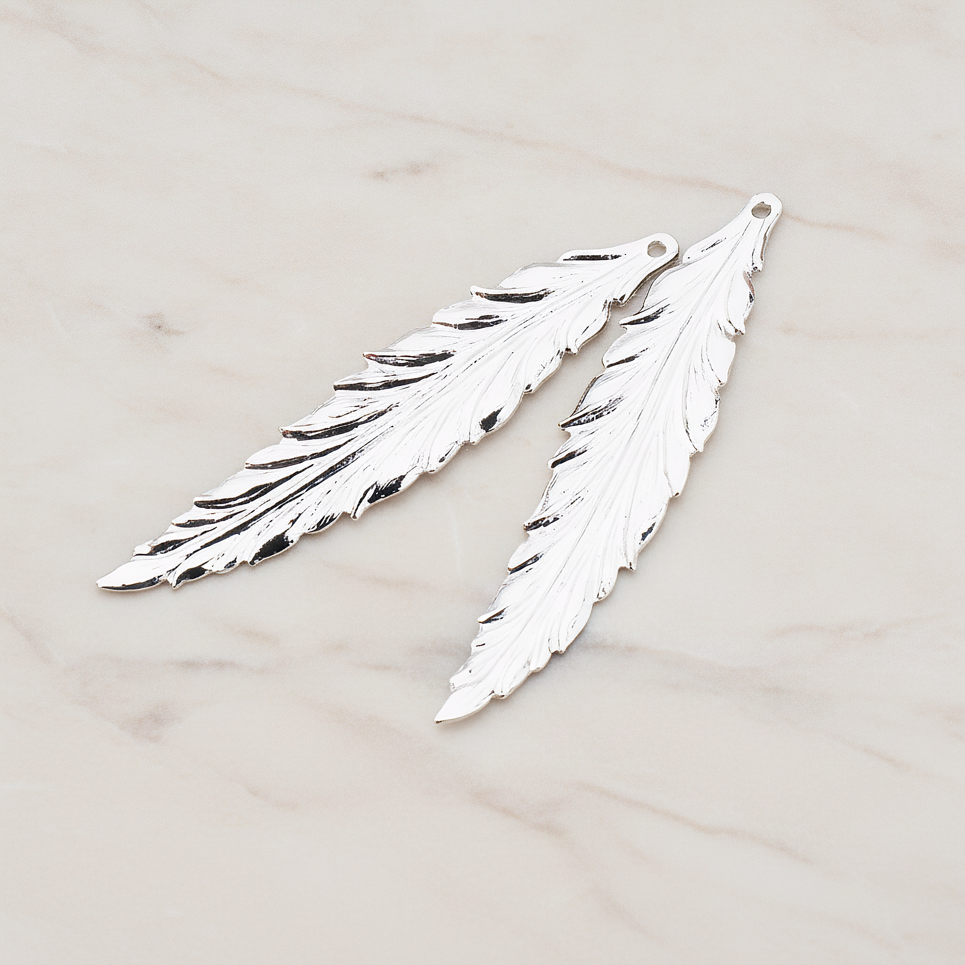Thin Long Leaf Pendant, 2 Pc on warm marble background (PD.575-02)