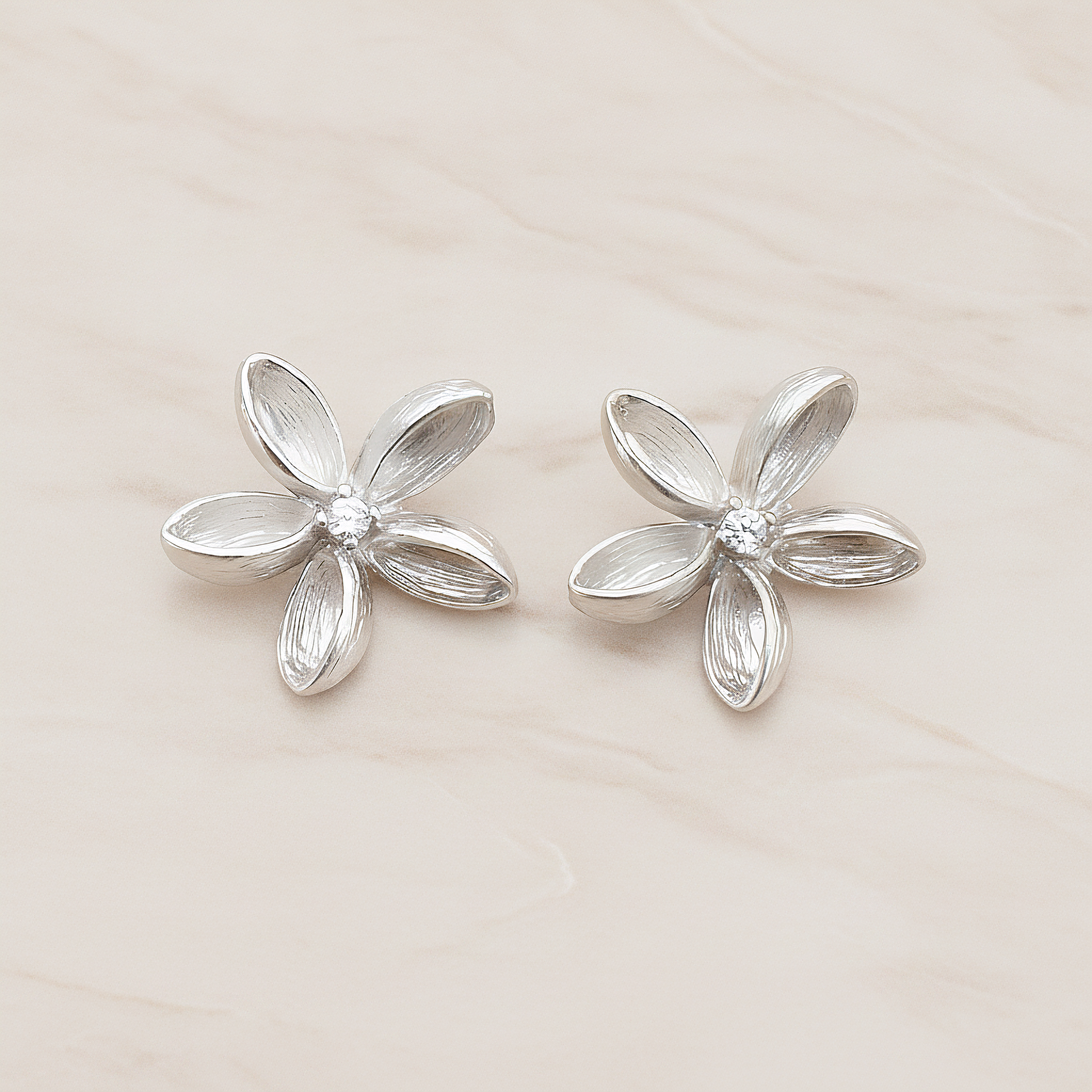 Clear Crystal Cubic Zirconia Centered Flower Pendant, 2 Pc on warm marble background (PD.592)