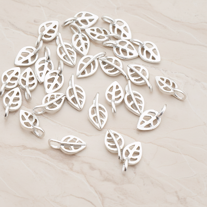 Mini Leaf Pendant, 4 Pc on warm marble background (PD.606)