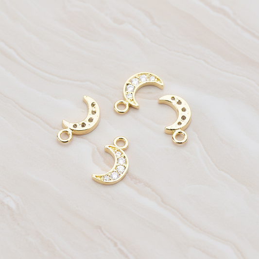 Clear Crystal Cubic Zirconia Setting Crescent Moon Pendant, 2 Pc on warm marble background (PD.750)