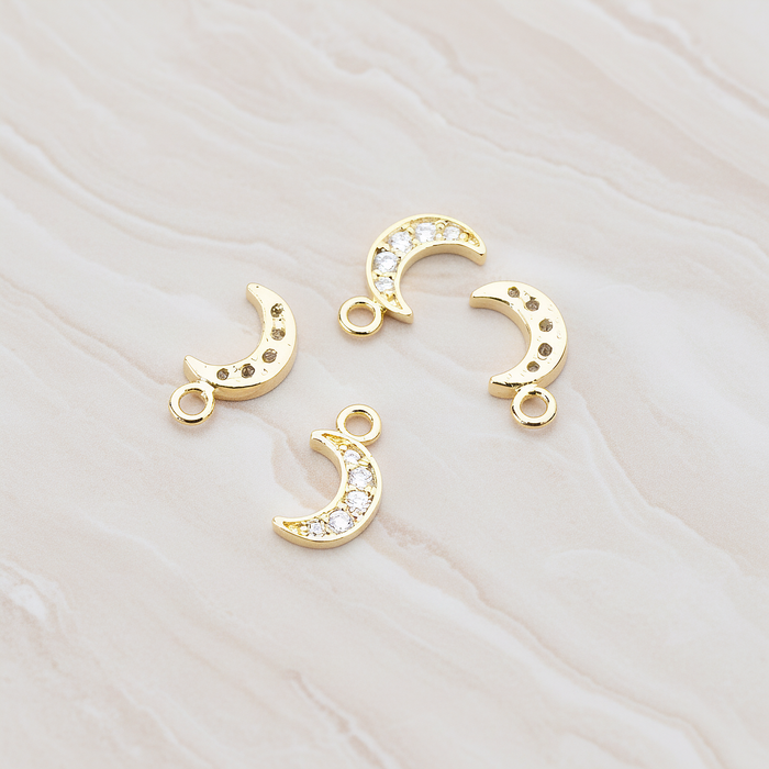 Clear Crystal Cubic Zirconia Setting Crescent Moon Pendant, 2 Pc on warm marble background (PD.750)