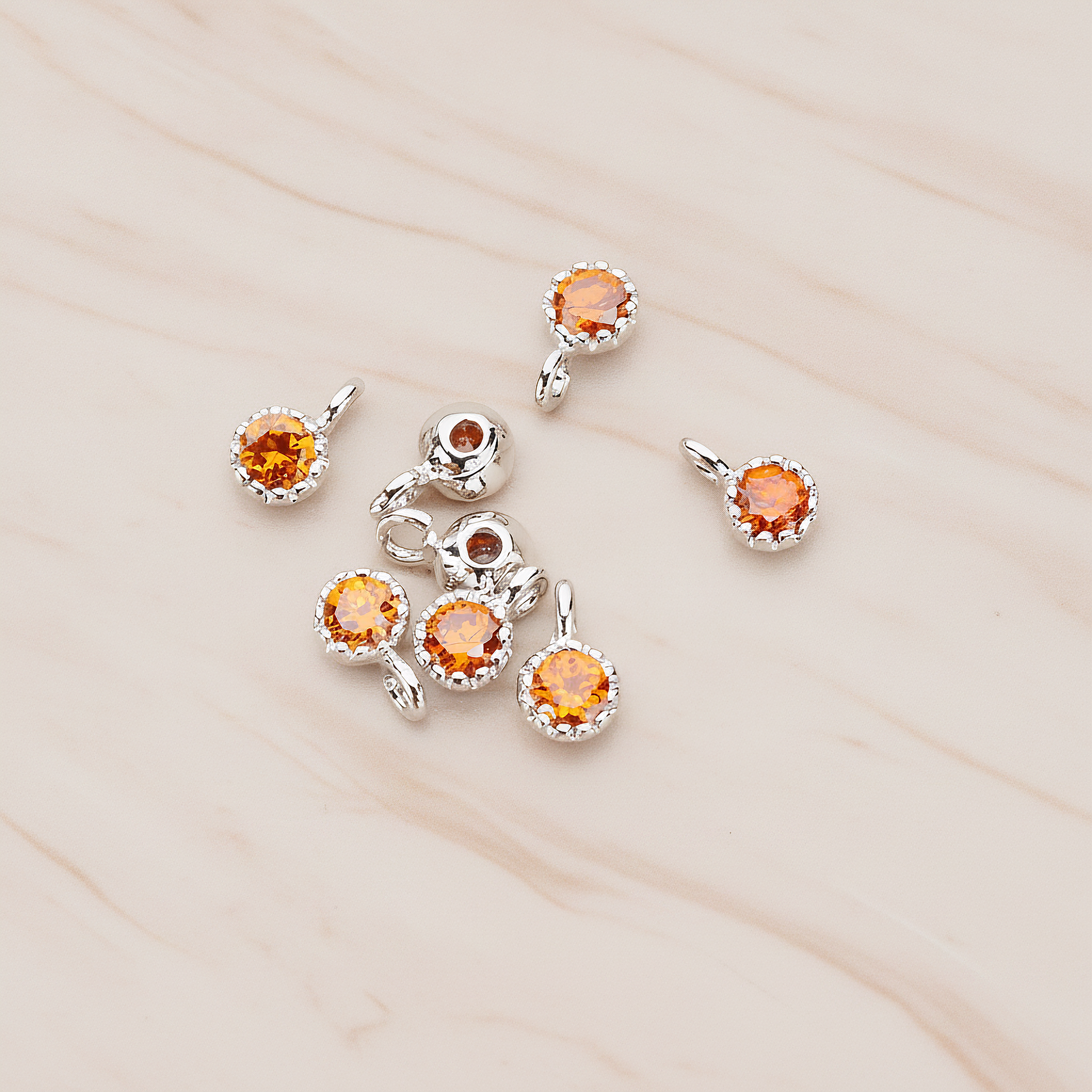 Cubic Zirconia Textured Framed Charm Pendant, 2 Pc on warm marble background (PD.780)