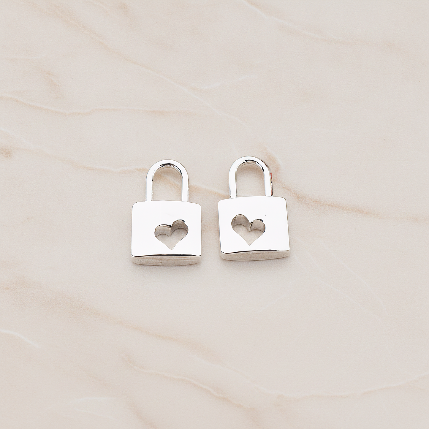 Heart Punched Lock Charm Pendant, 2 Pc on warm marble background (PD.810)