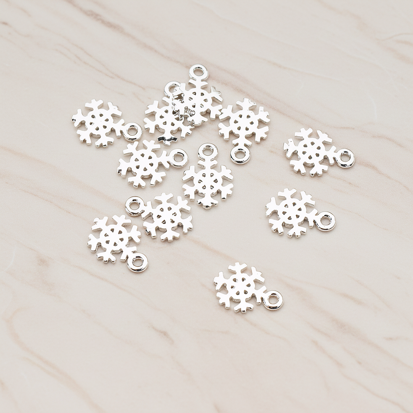 Snow Flake Charm Pendant, 2 Pc on warm marble background (PD.835)