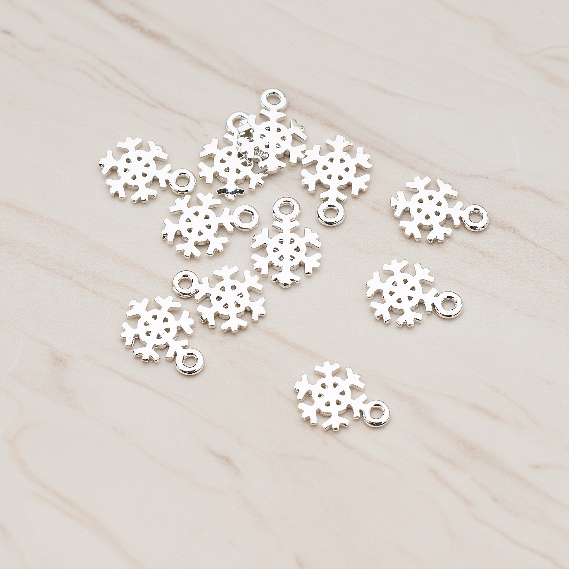 Snow Flake Charm Pendant, 2 Pc on warm marble background (PD.835)