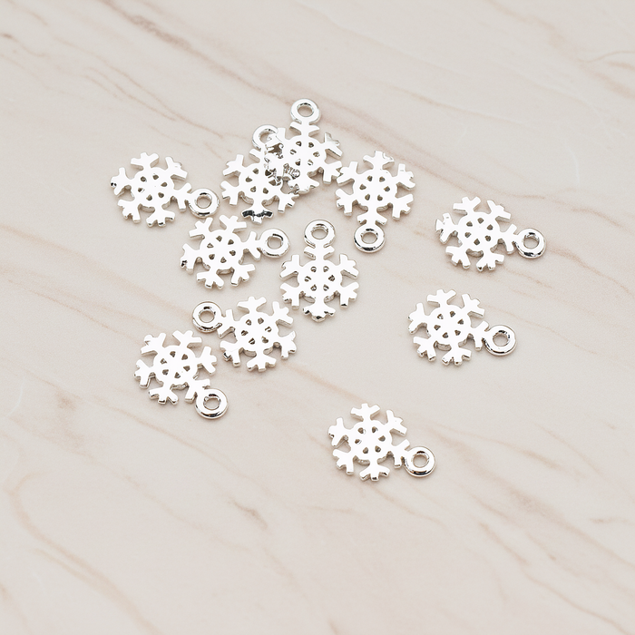 Snow Flake Charm Pendant, 2 Pc on warm marble background (PD.835)