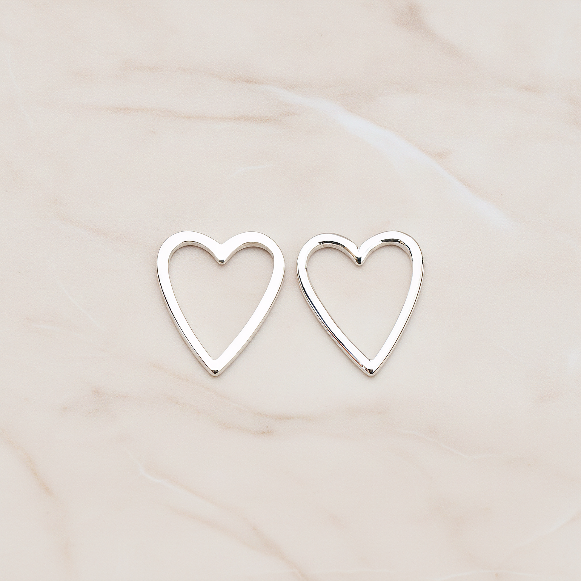 Heart Link Pendant, 2 Pc on warm marble background (PD.879)