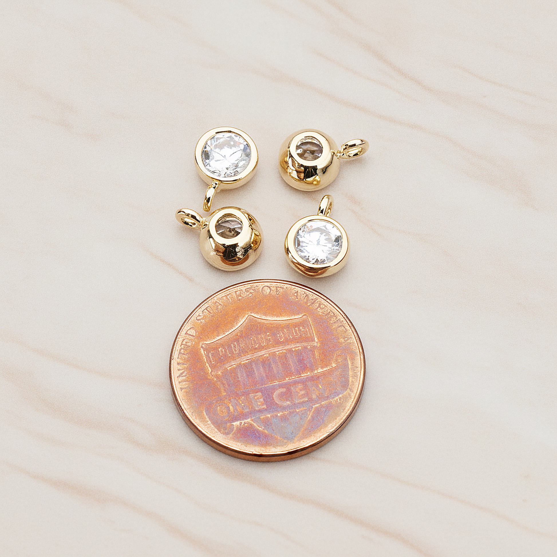 Round Smooth Framed Cubic Zirconia Pendant, 2 Pc on warm marble background (PD.883)