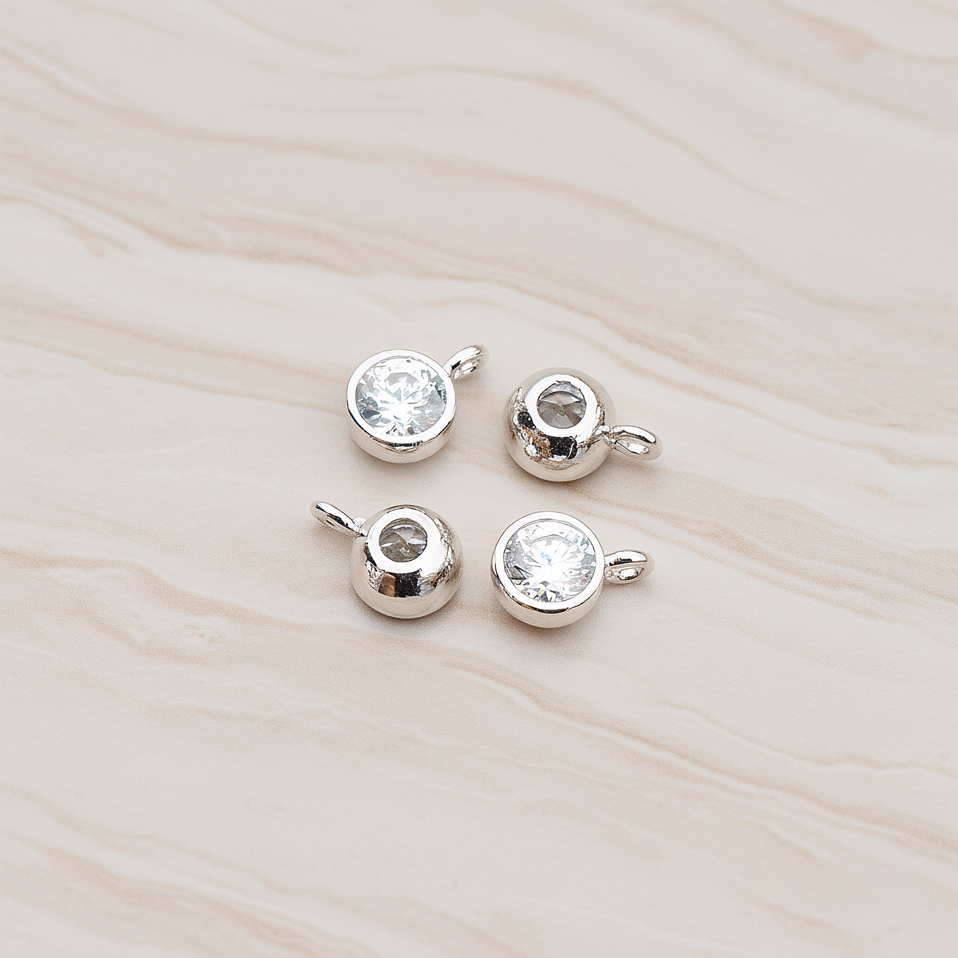 Round Smooth Framed Cubic Zirconia Pendant, 2 Pc on warm marble background (PD.883)