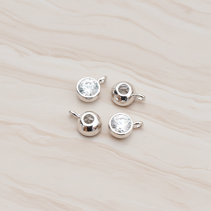 Round Smooth Framed Cubic Zirconia Pendant, 2 Pc on warm marble background (PD.883)