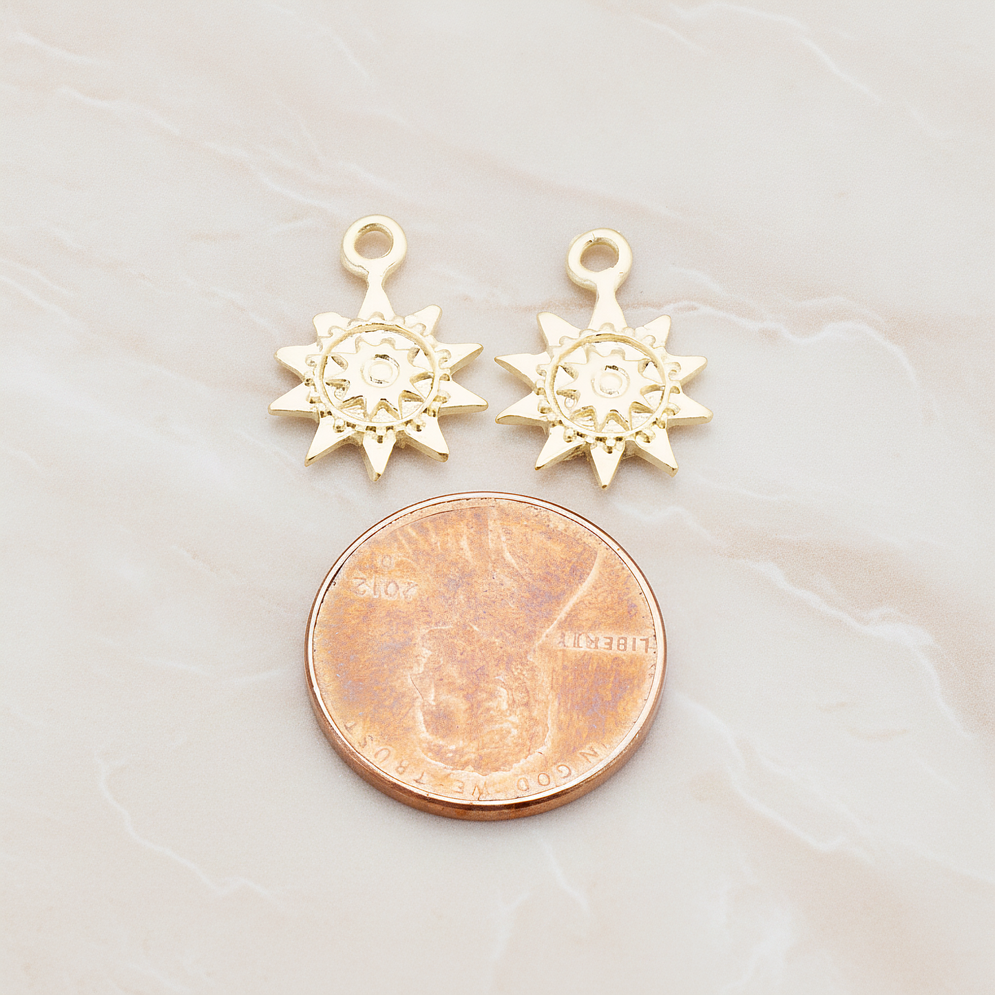 Double Sun Charm Pendant, 2 Pc on warm marble background (PD.906)
