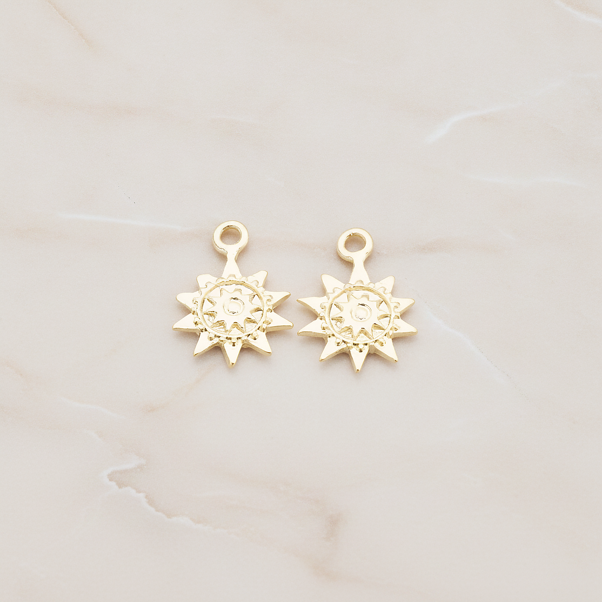 Double Sun Charm Pendant, 2 Pc on warm marble background (PD.906)