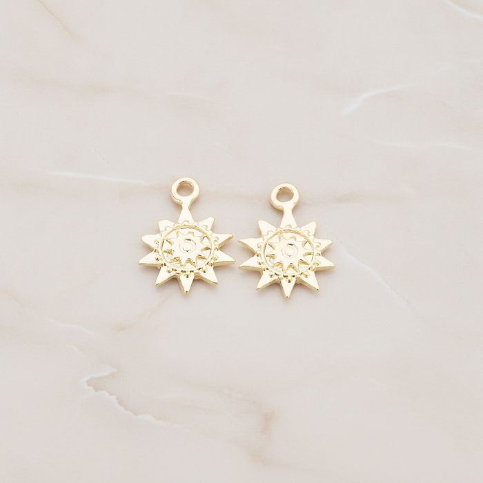 Double Sun Charm Pendant, 2 Pc on warm marble background (PD.906)