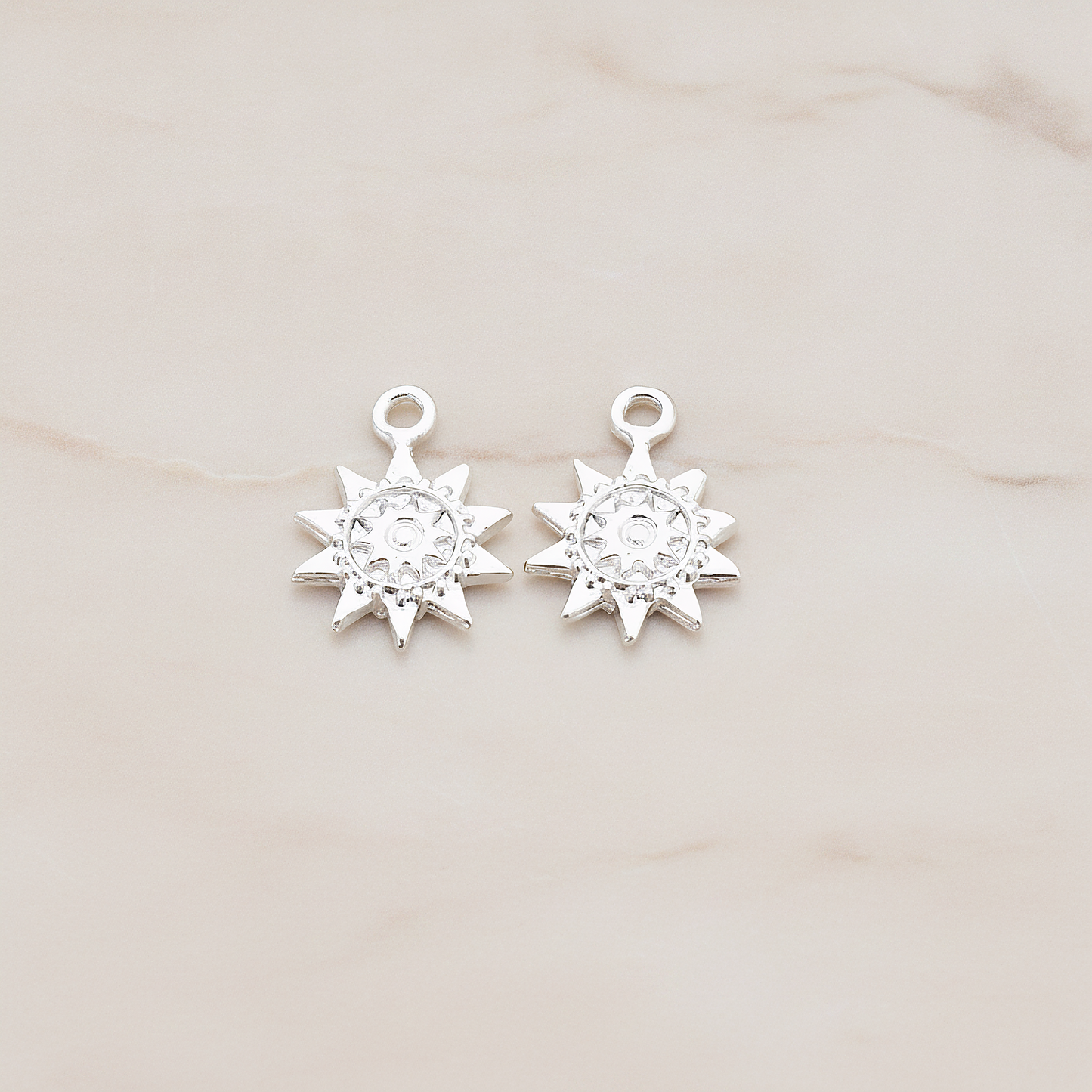 Double Sun Charm Pendant, 2 Pc on warm marble background (PD.906)