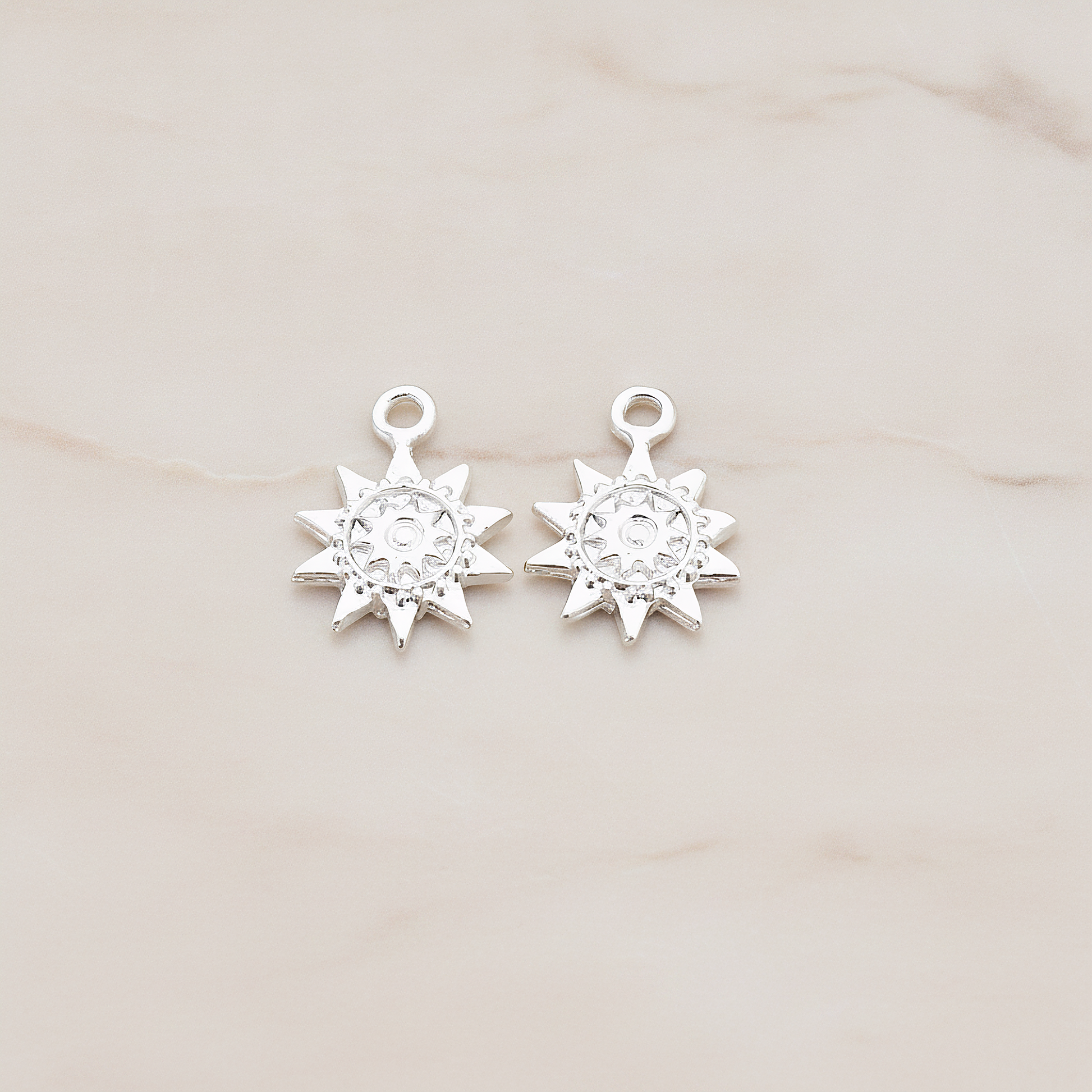 Double Sun Charm Pendant, 2 Pc on warm marble background (PD.906)