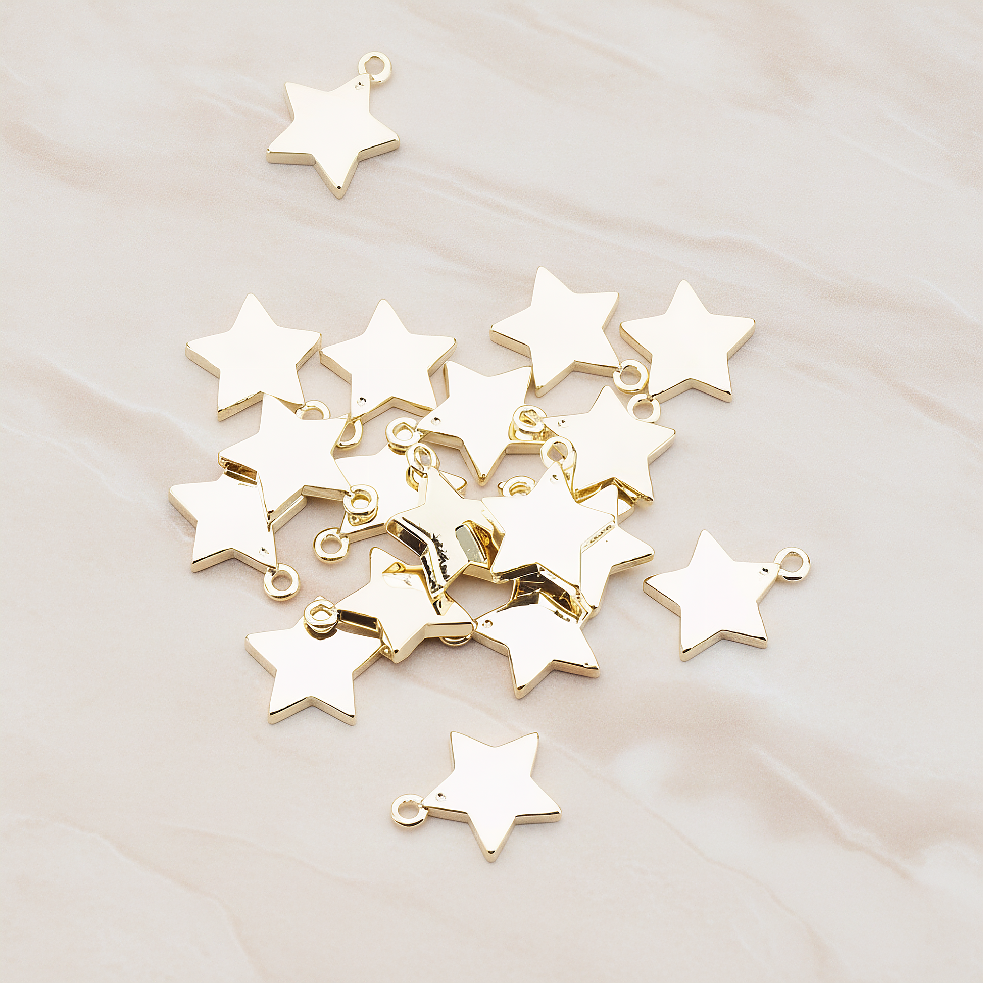 Mini Star Pendant, 2 Pc on warm marble background (PD.925)
