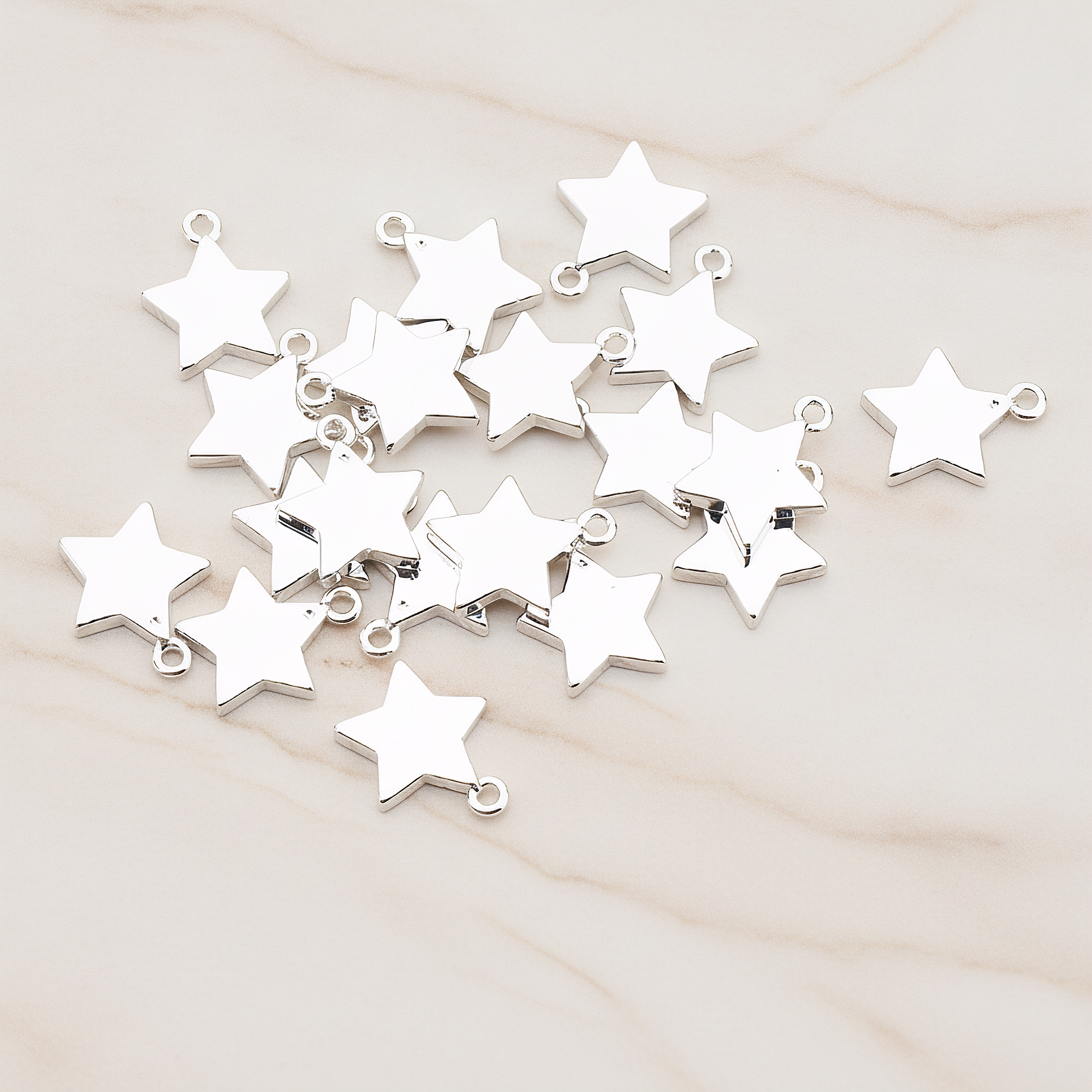 Mini Star Pendant, 2 Pc on warm marble background (PD.925)