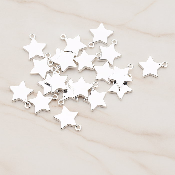 Mini Star Pendant, 2 Pc on warm marble background (PD.925)
